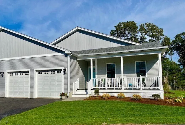 front view of a house with a yard