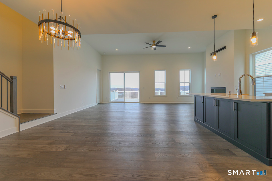 35 Lookout Ridge, Unit 35 Danbury, CT 06810 - Photo 13 of 38 a view of a room with wooden floor and windows