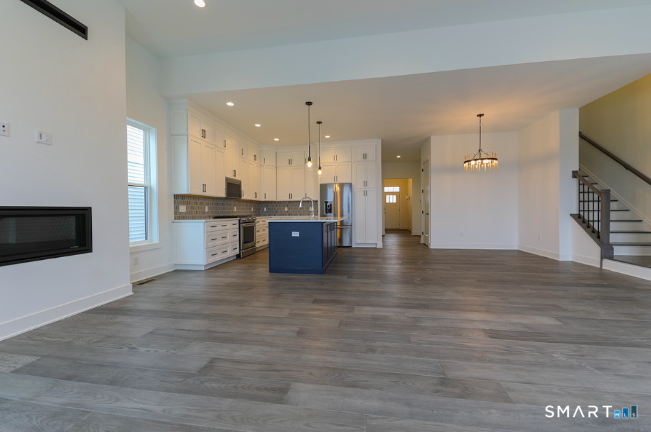35 Lookout Ridge, Unit 35 Danbury, CT 06810 - Photo 20 of 38 a view of kitchen with kitchen island wooden floor and refrigerator