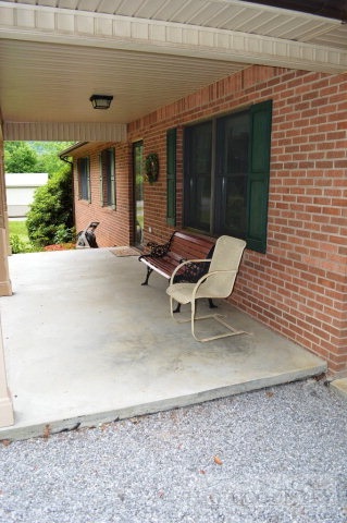 277 Pioneer Ridge Sparta, NC 28675 - Photo 14 of 36 a backyard of a house with outdoor seating