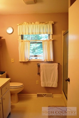 277 Pioneer Ridge Sparta, NC 28675 - Photo 3 of 36 a bathroom with a toilet and a shower
