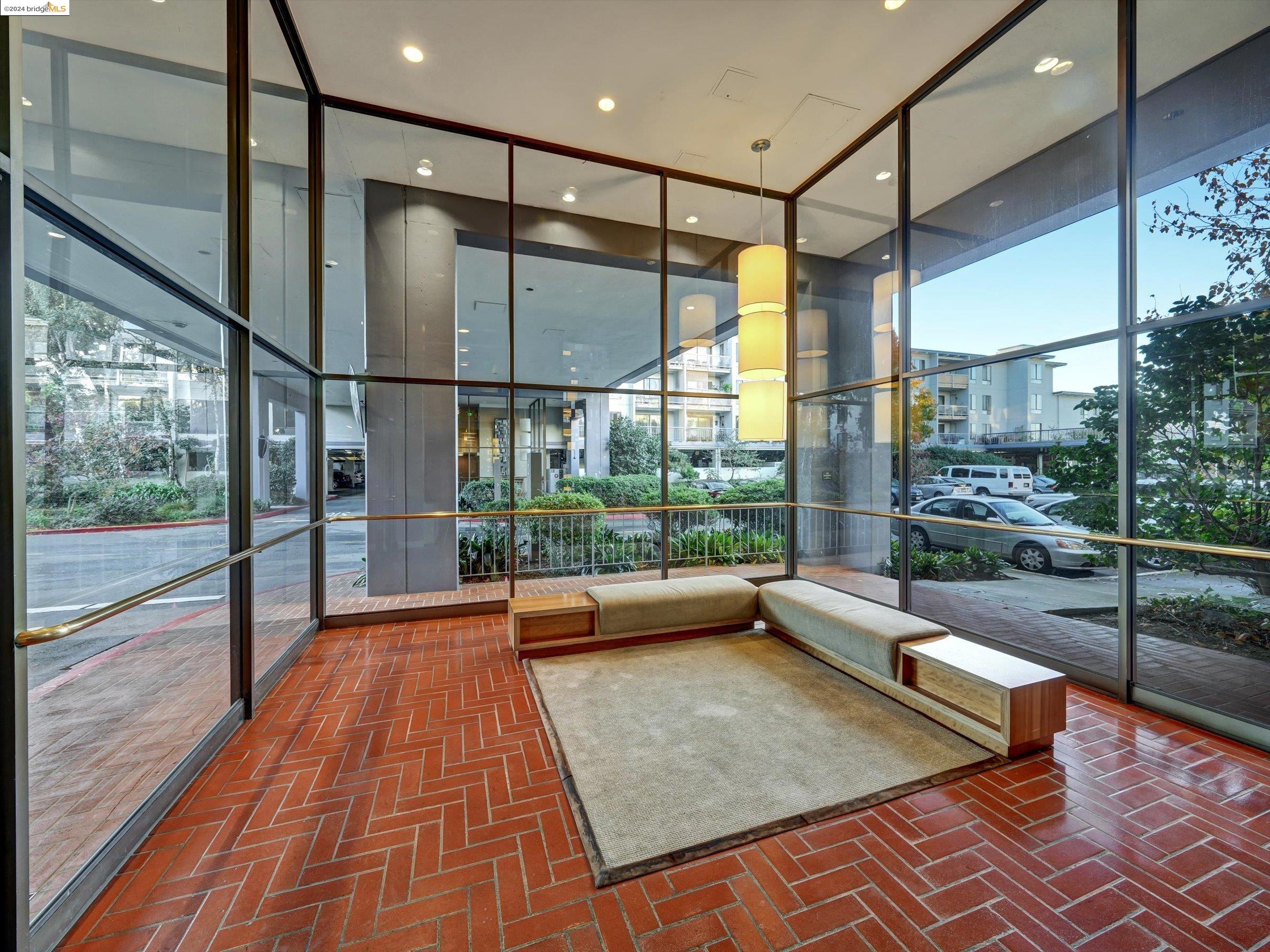 a living room with wooden floor and furniture