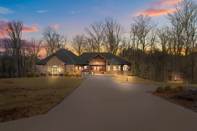 a view of a house with snow on the road