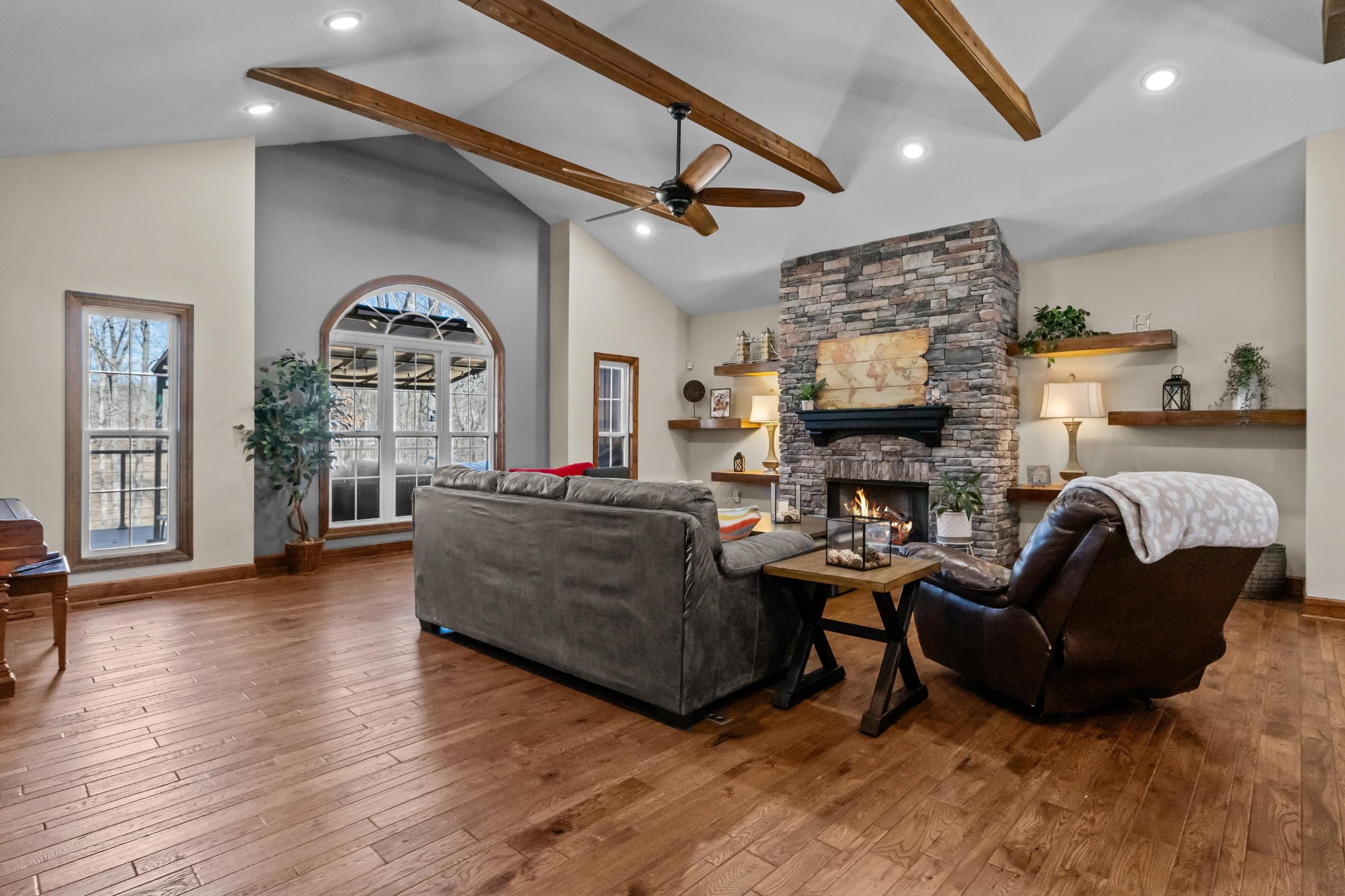 1816 McKelvy Road Camden, TN 38320 - Photo 16 of 100 a living room with furniture a fireplace and a large window