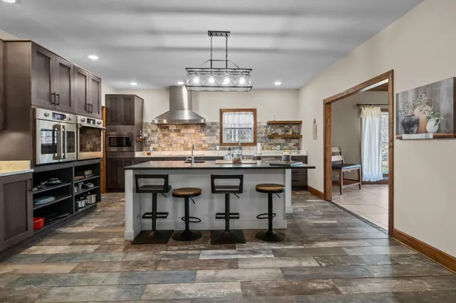 a living room with furniture rug and window