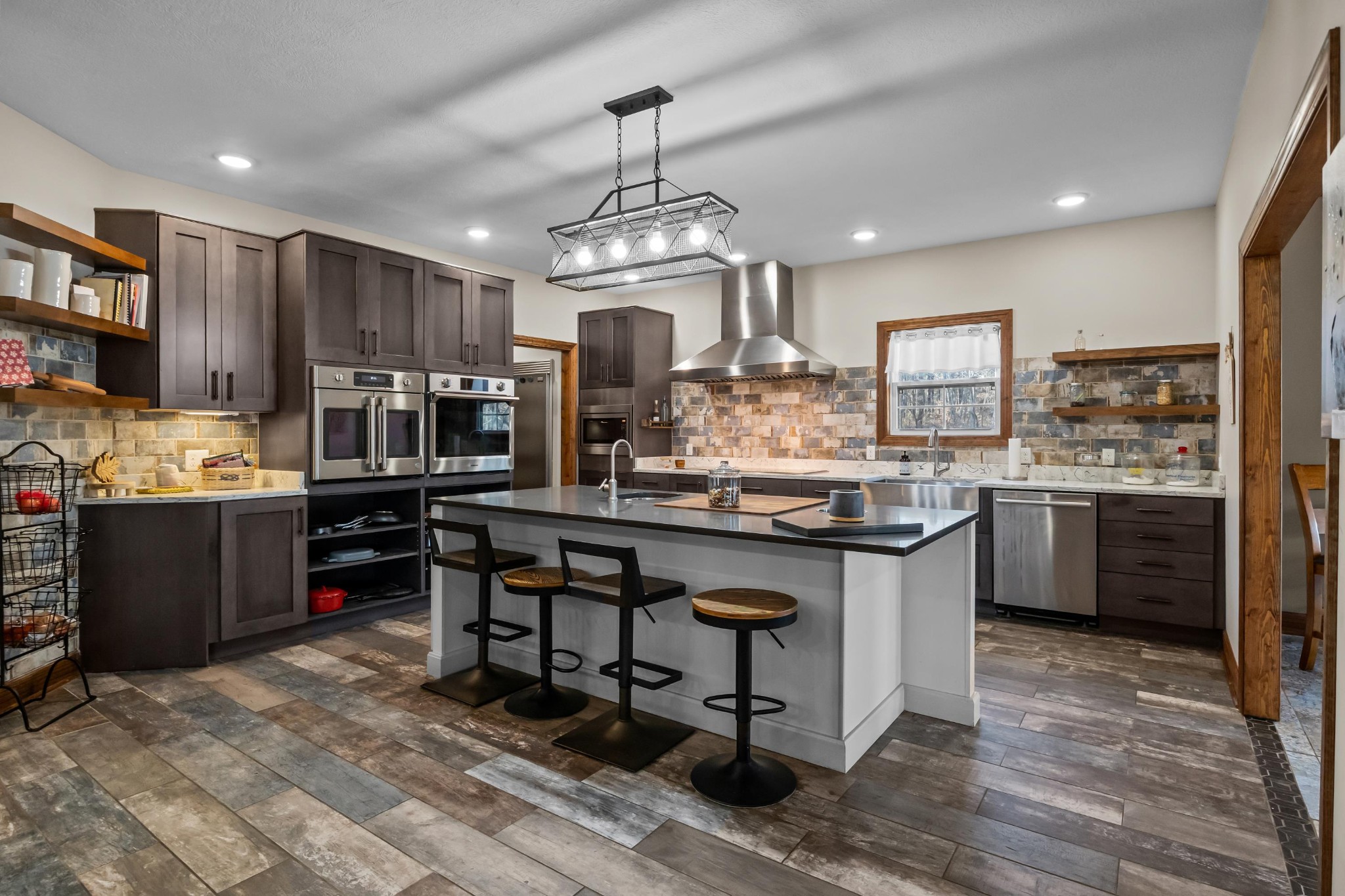 1816 McKelvy Road Camden, TN 38320 - Photo 18 of 100 a kitchen with stainless steel appliances kitchen island granite countertop a sink counter space and cabinets