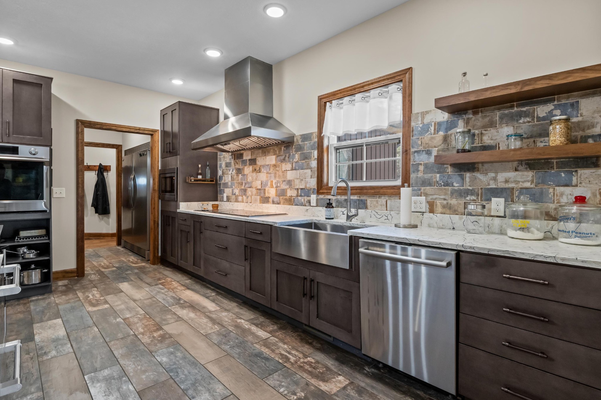 1816 McKelvy Road Camden, TN 38320 - Photo 20 of 100 a kitchen with stainless steel appliances granite countertop a sink and cabinets