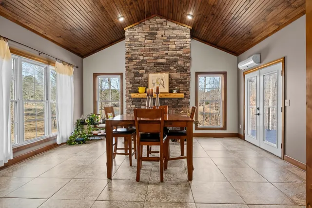 a view of a livingroom with workspace and a couch