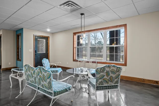 a view of a air conditioner and a floor to ceiling window