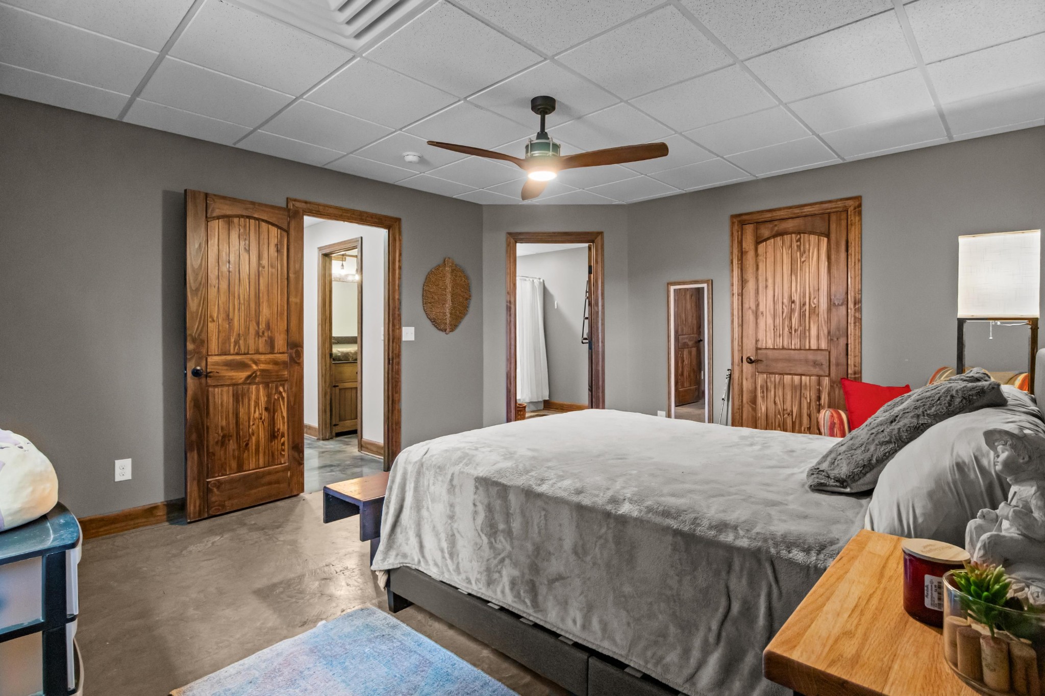 1816 McKelvy Road Camden, TN 38320 - Photo 54 of 100 a bedroom with a bed and a chandelier