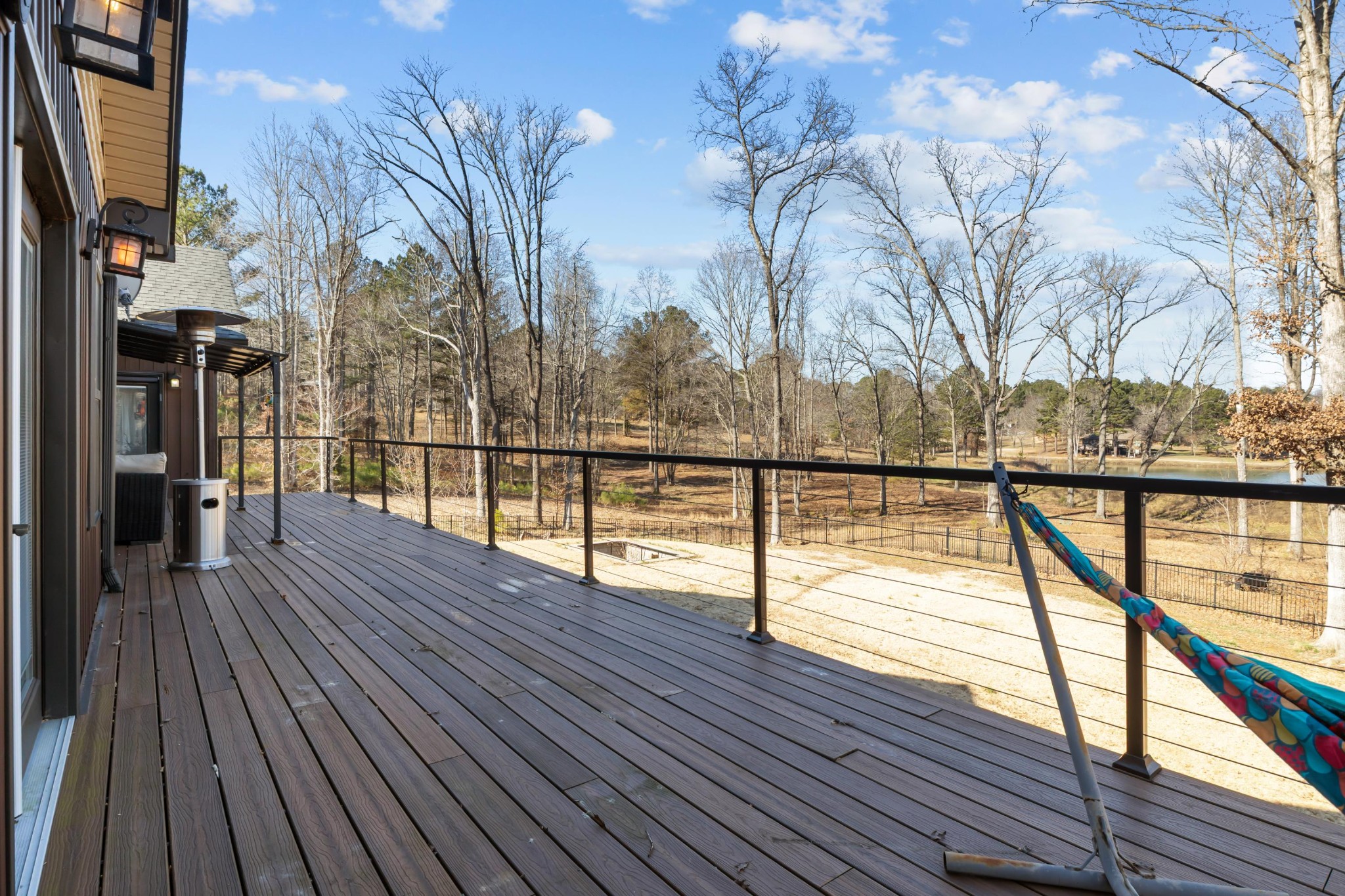 1816 McKelvy Road Camden, TN 38320 - Photo 65 of 100 a view of a balcony with wooden floor and fence