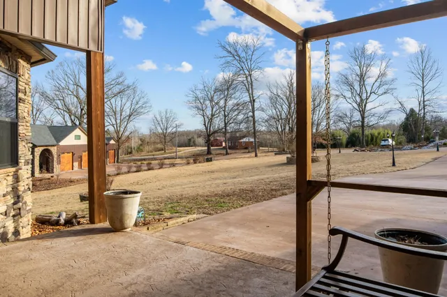 a kitchen with stainless steel appliances kitchen island granite countertop a sink counter space and cabinets
