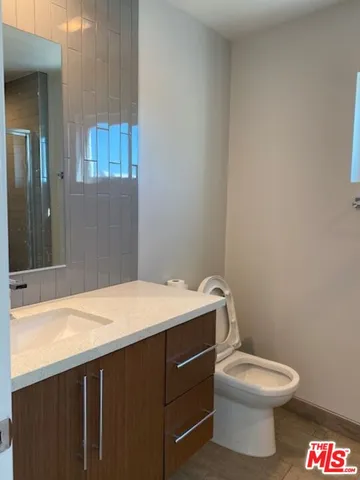 a view of a balcony with two chairs