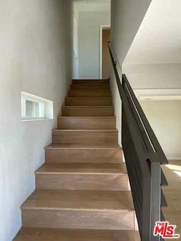 a view of an empty room and a window