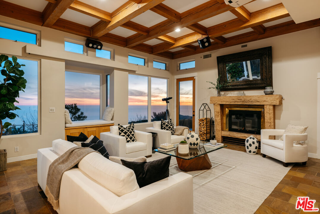 401 Moonrise Drive Malibu, CA 90265 - Photo 1 of 47 a living room with furniture and a fireplace