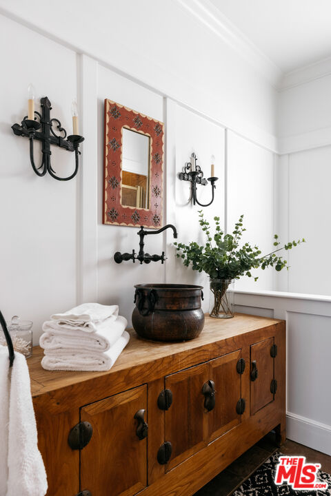 401 Moonrise Drive Malibu, CA 90265 - Photo 14 of 47 a bathroom with a sink and a mirror