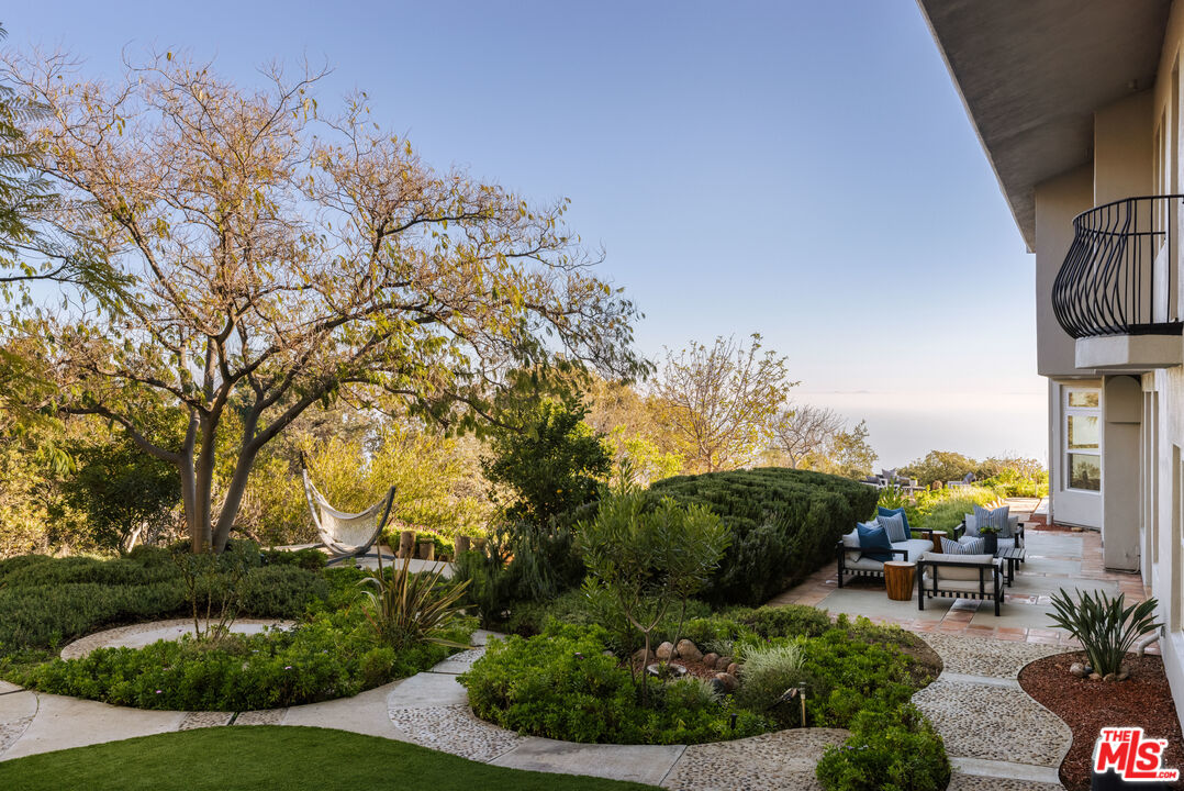 401 Moonrise Drive Malibu, CA 90265 - Photo 15 of 47 a view of a backyard with sitting area