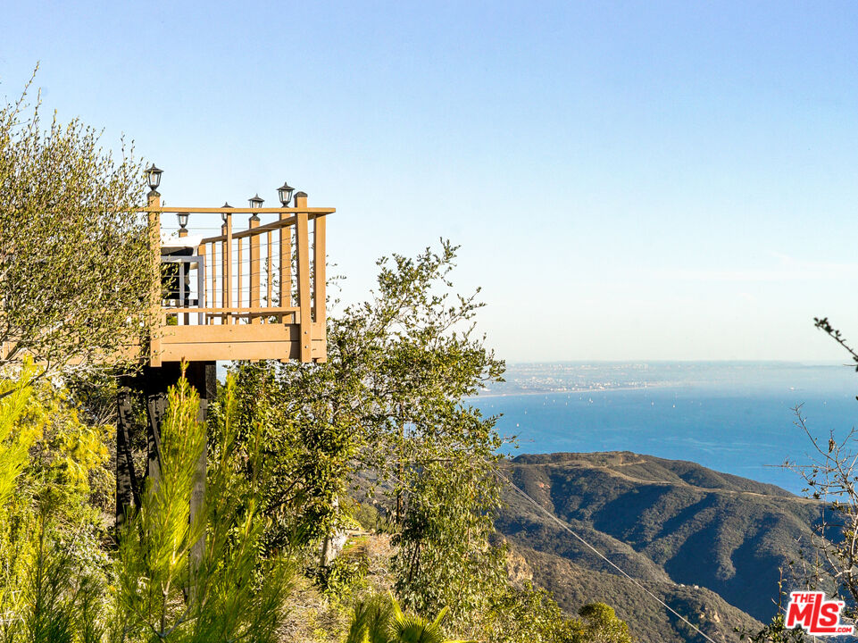 401 Moonrise Drive Malibu, CA 90265 - Photo 19 of 47 a view of a yard with an ocean view