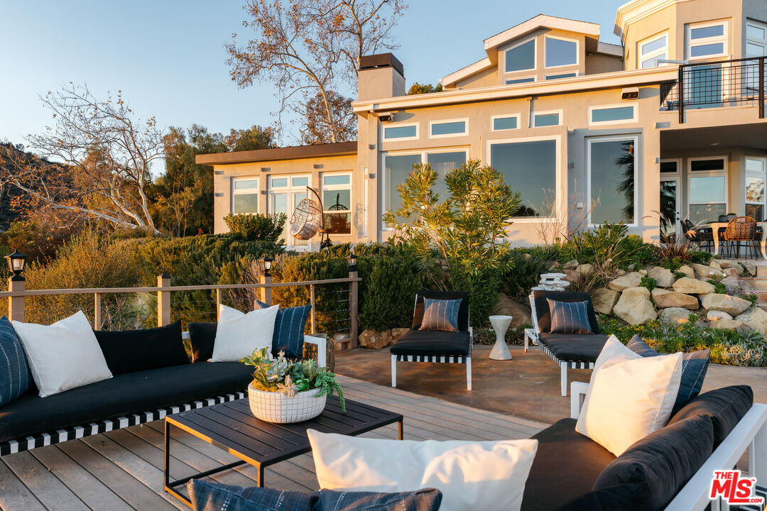 401 Moonrise Drive Malibu, CA 90265 - Photo 20 of 47 a front view of a house with outdoor seating