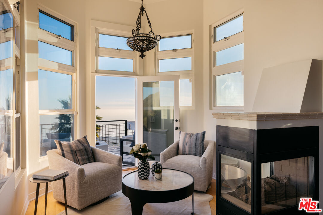 401 Moonrise Drive Malibu, CA 90265 - Photo 22 of 47 a living room with furniture and a window
