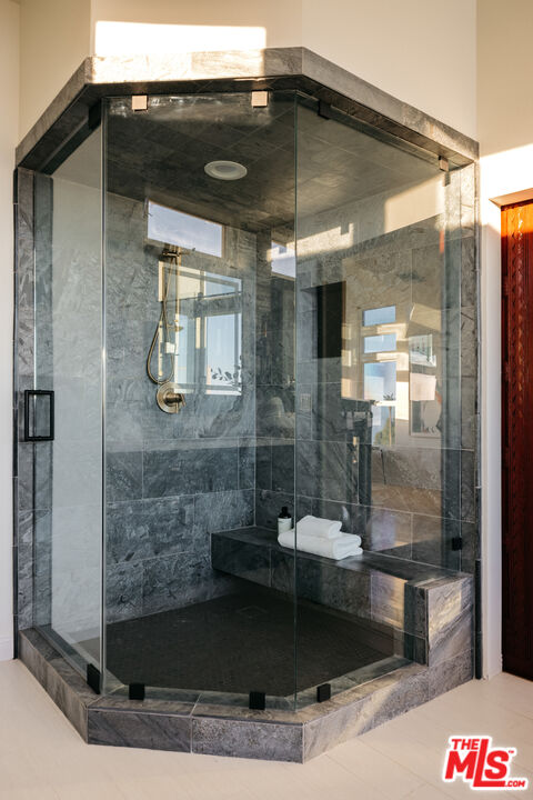 401 Moonrise Drive Malibu, CA 90265 - Photo 27 of 47 a bathroom with a bathtub and shower