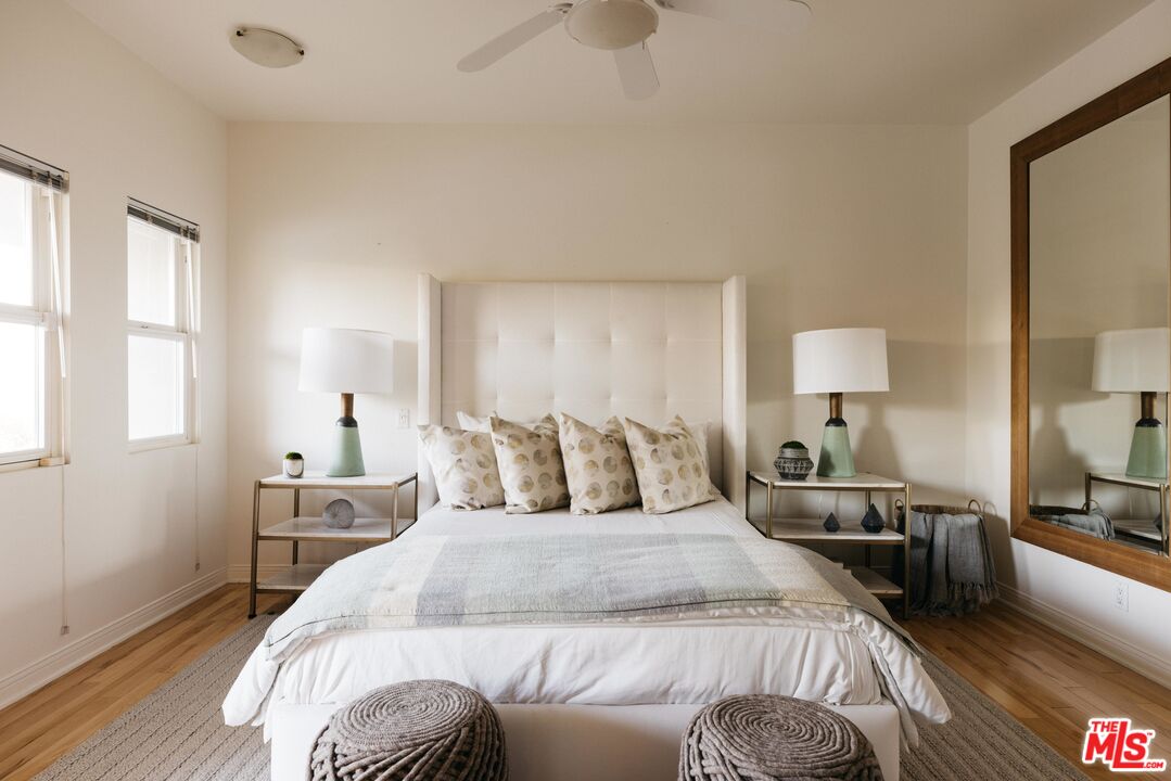 401 Moonrise Drive Malibu, CA 90265 - Photo 28 of 47 a bedroom with a bed and wooden floor