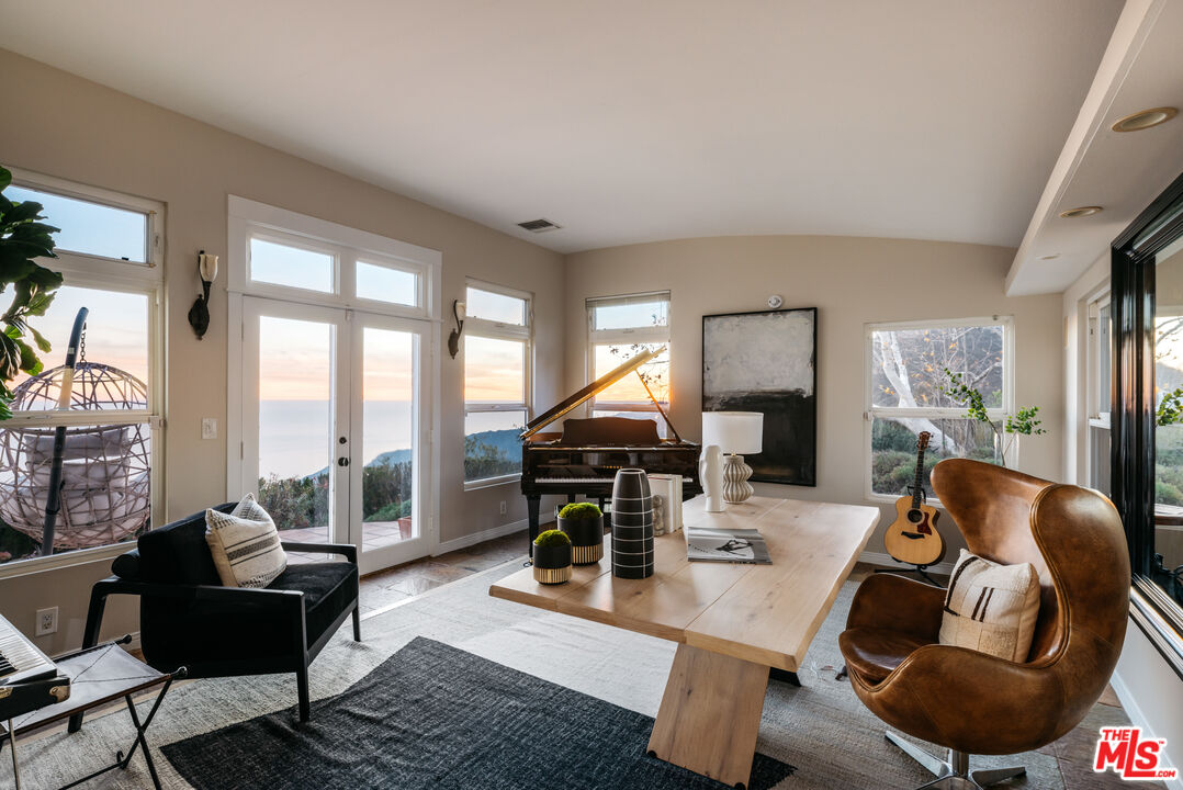 401 Moonrise Drive Malibu, CA 90265 - Photo 34 of 47 a living room with furniture and a large window
