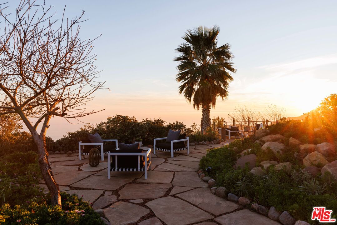 401 Moonrise Drive Malibu, CA 90265 - Photo 38 of 47 a view of a terrace with a garden