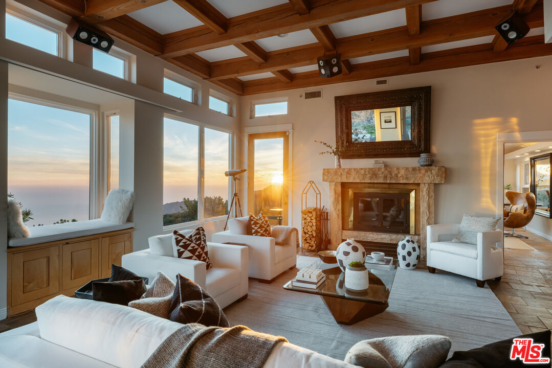 401 Moonrise Drive Malibu, CA 90265 - Photo 42 of 47 a living room with furniture and a fireplace