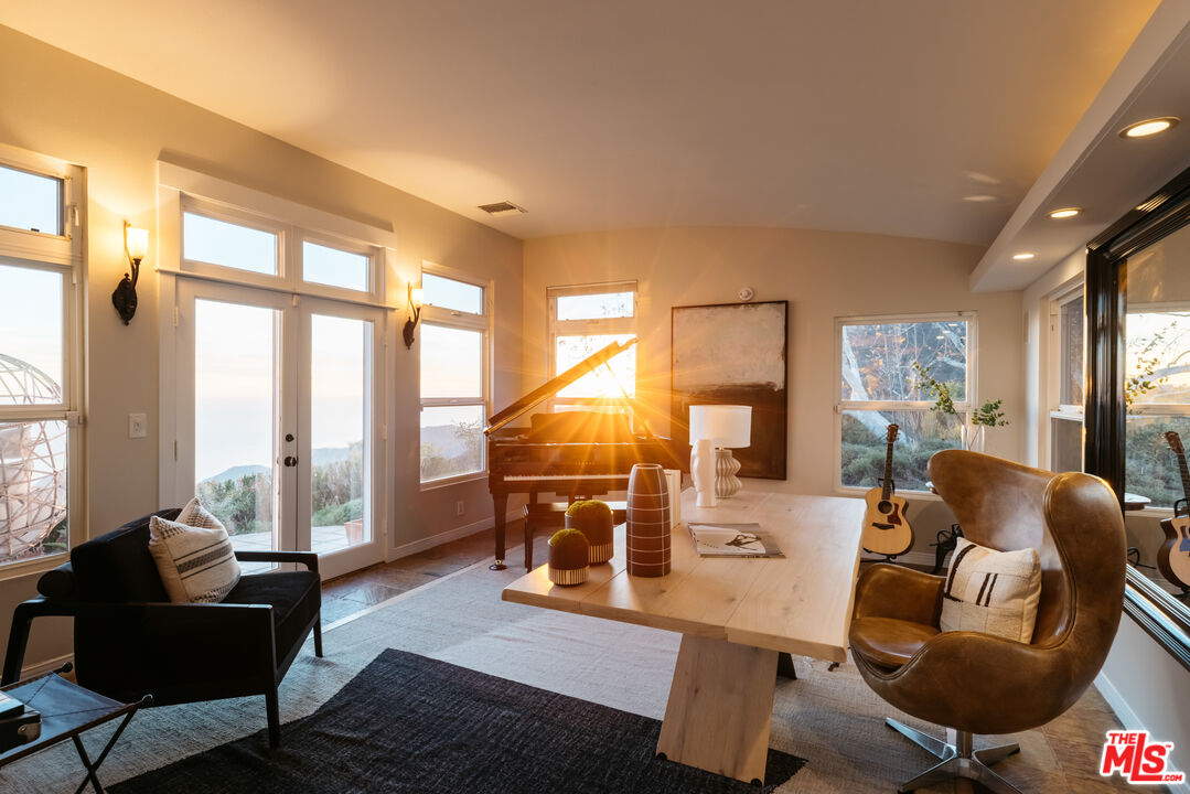 401 Moonrise Drive Malibu, CA 90265 - Photo 43 of 47 a living room with furniture and a large window