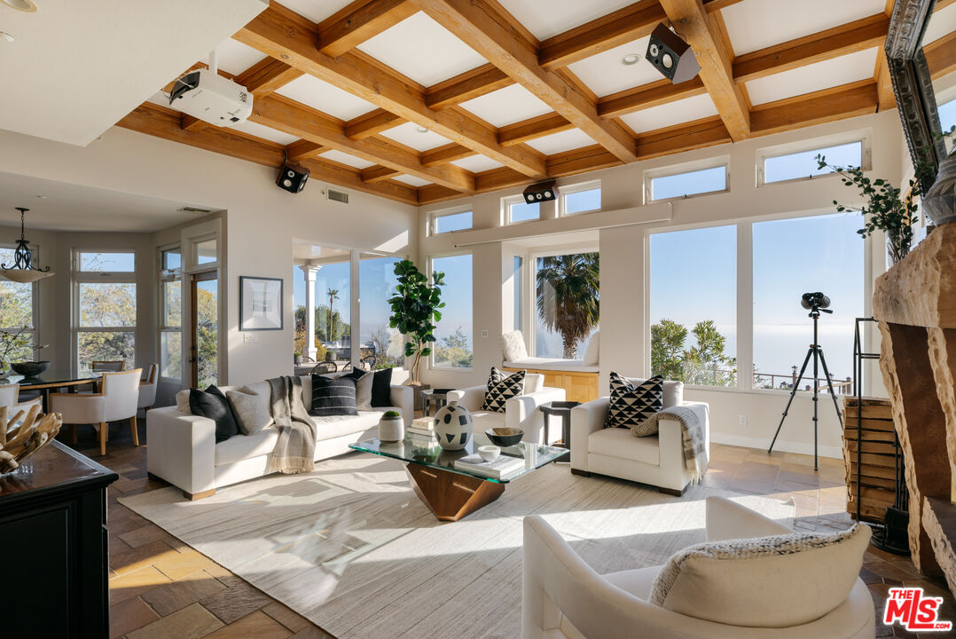 401 Moonrise Drive Malibu, CA 90265 - Photo 7 of 47 a living room with furniture and a large window