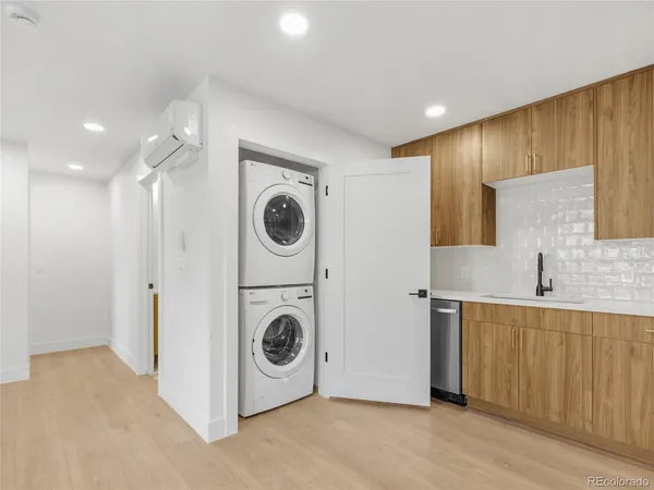 a view of kitchen sink and stove top oven
