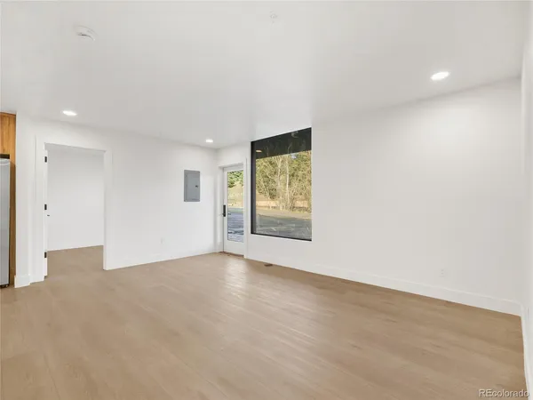 a view of an empty room with a window
