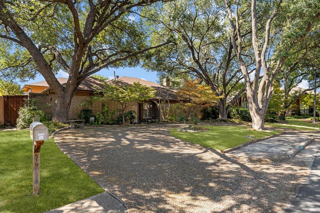 6214 Oakleaf Road Dallas, TX 75248 - Photo 1 of 2 Towering oaks welcome you