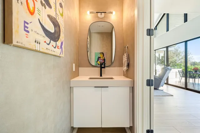 a bathroom with a sink and a mirror