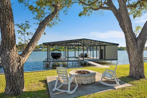 a view of swimming pool with outdoor seating and yard