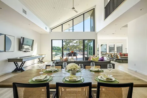 a living room with fireplace furniture and a wooden floor