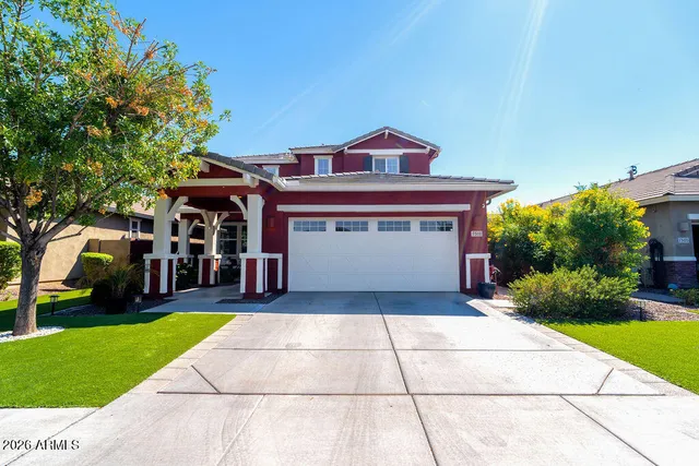 a view of a house with a yard and plants
