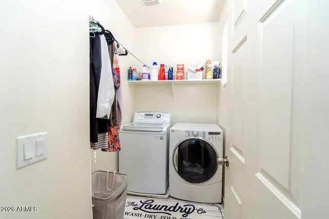 a utility room with dryer and washer