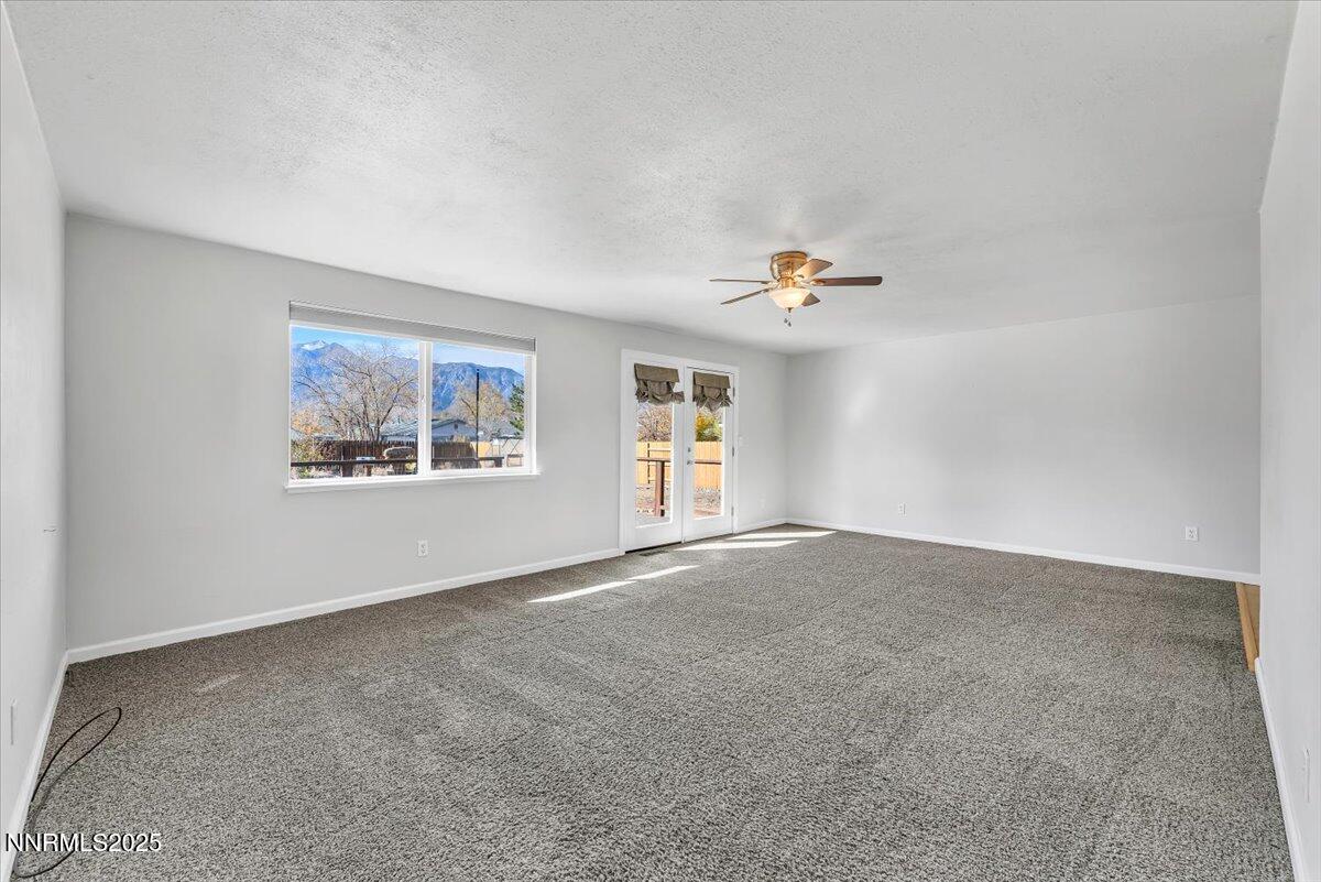 1275 Bolivia Way Gardnerville, NV 89460 - Photo 11 of 59 a view of a livingroom with wooden floor and window