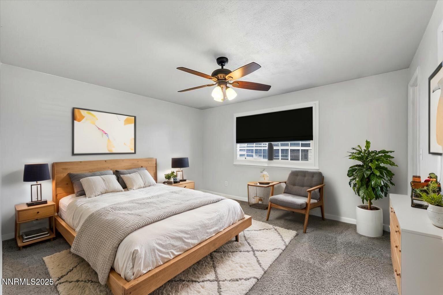 1275 Bolivia Way Gardnerville, NV 89460 - Photo 20 of 59 a bedroom with a bed and a flat screen tv