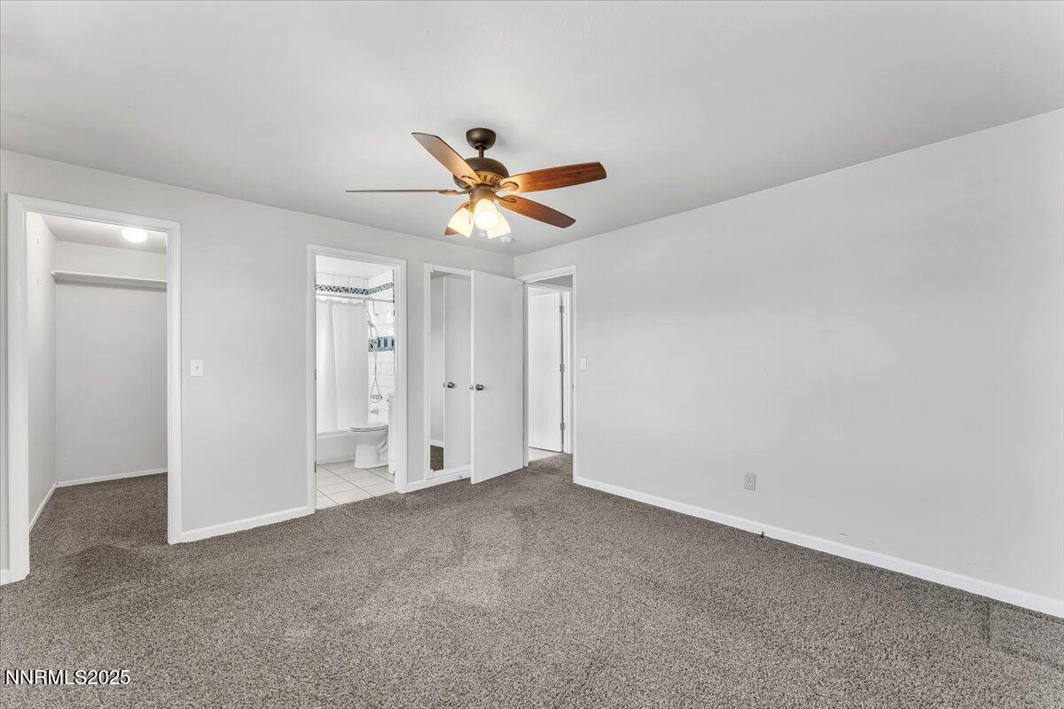 1275 Bolivia Way Gardnerville, NV 89460 - Photo 22 of 59 a view of a livingroom with a ceiling fan and hardwood floor