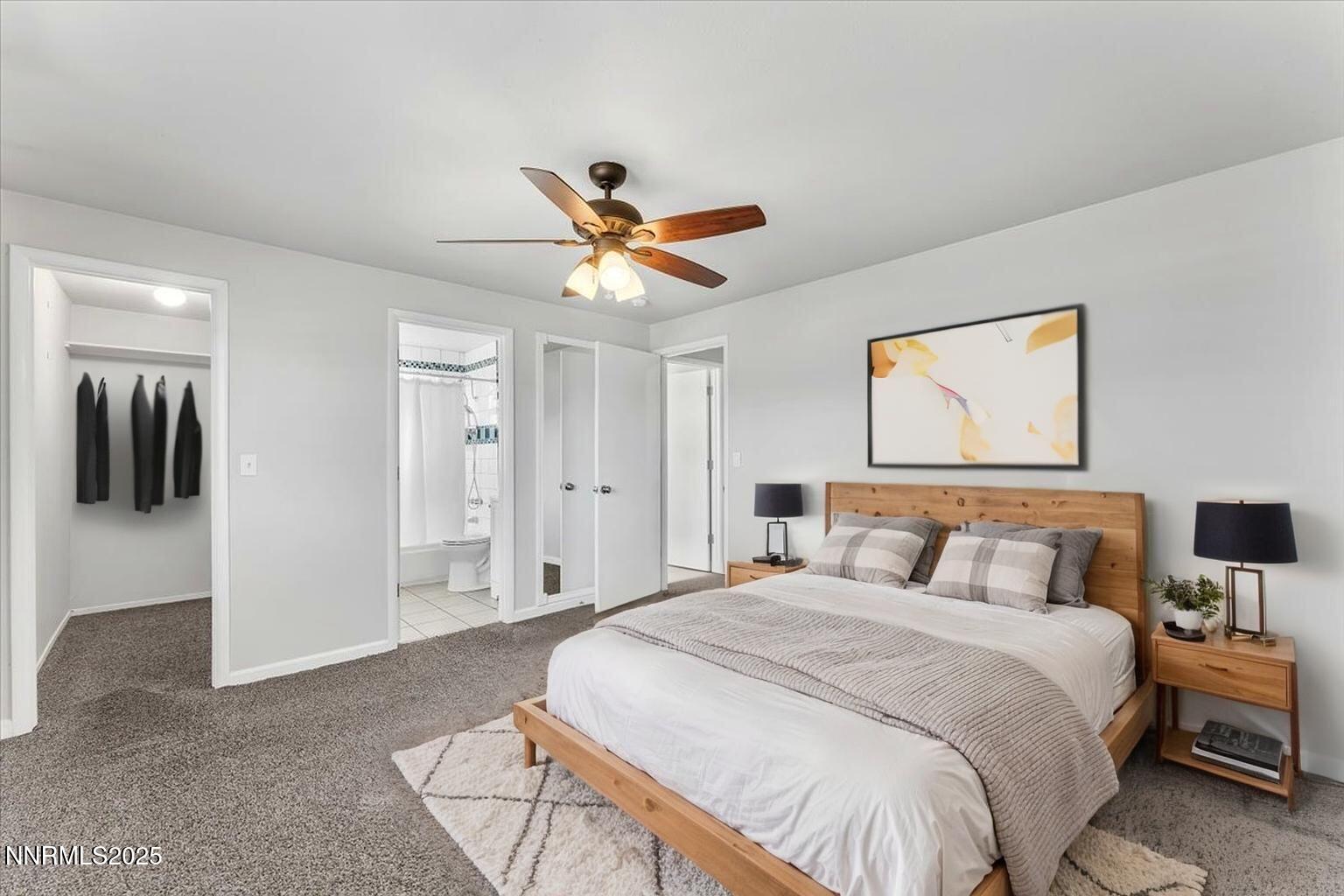 1275 Bolivia Way Gardnerville, NV 89460 - Photo 23 of 59 a bedroom with a bed and a chandelier