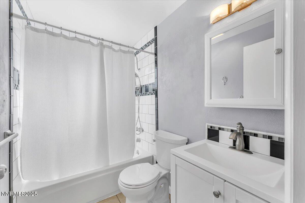 1275 Bolivia Way Gardnerville, NV 89460 - Photo 24 of 59 a bathroom with a sink a toilet and shower