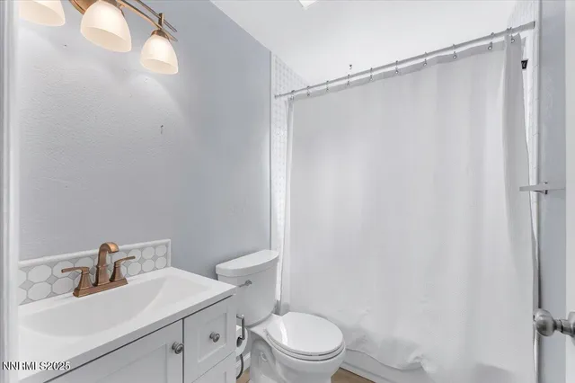 a front view of a house with a yard and balcony