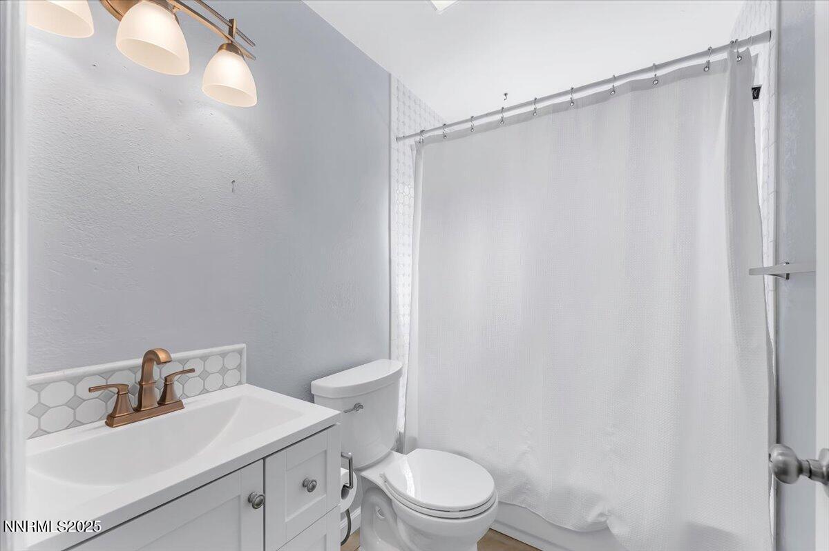 1275 Bolivia Way Gardnerville, NV 89460 - Photo 26 of 59 a bathroom with a sink a toilet and shower