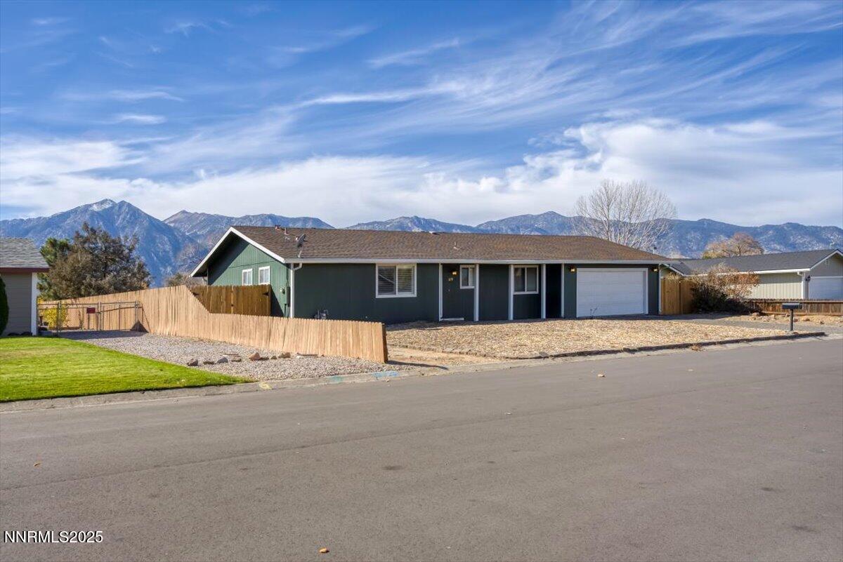 1275 Bolivia Way Gardnerville, NV 89460 - Photo 29 of 59 a front view of a house with a yard and balcony