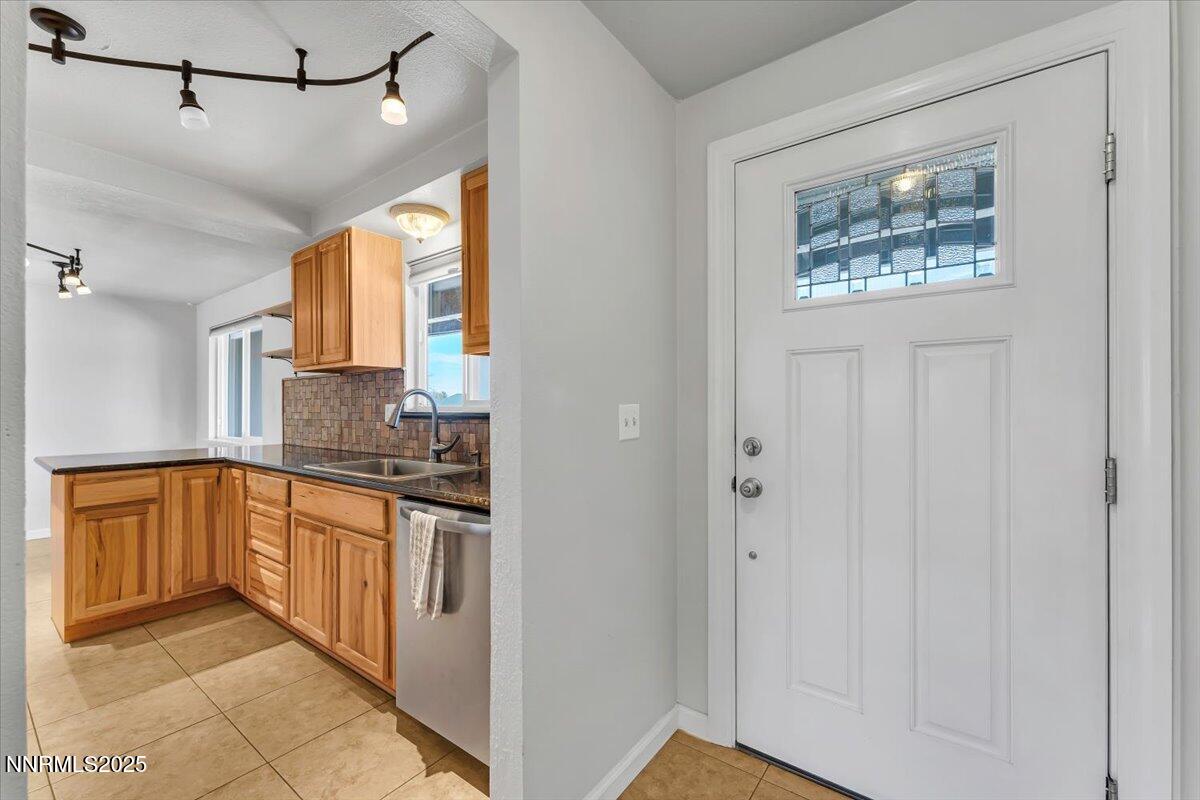 1275 Bolivia Way Gardnerville, NV 89460 - Photo 6 of 59 a kitchen with stainless steel appliances granite countertop a refrigerator and a sink