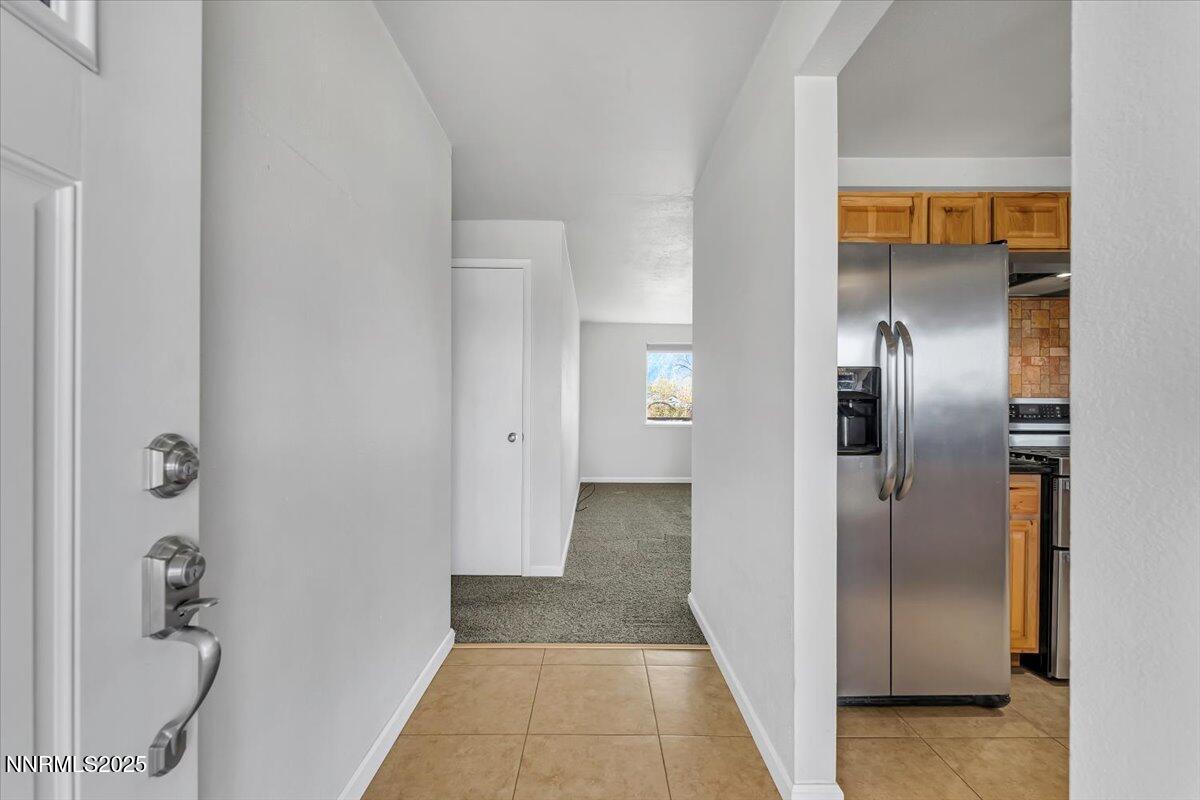1275 Bolivia Way Gardnerville, NV 89460 - Photo 7 of 59 a view of a hallway with wooden shelves