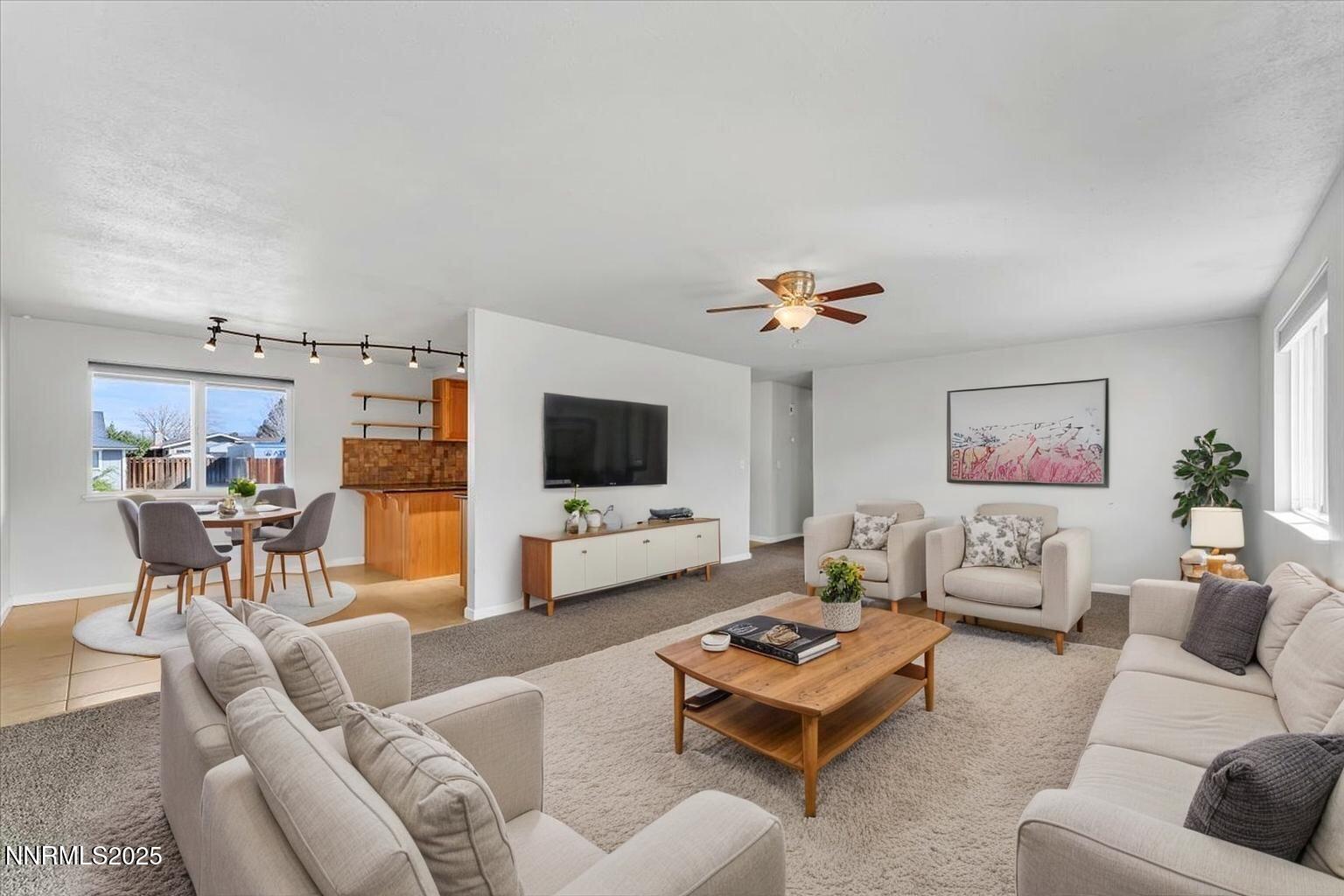 1275 Bolivia Way Gardnerville, NV 89460 - Photo 8 of 59 a living room with furniture and a flat screen tv